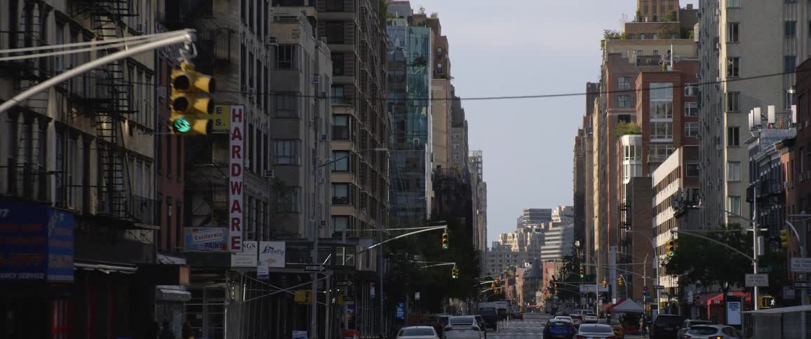 Cars drive on the road in the city