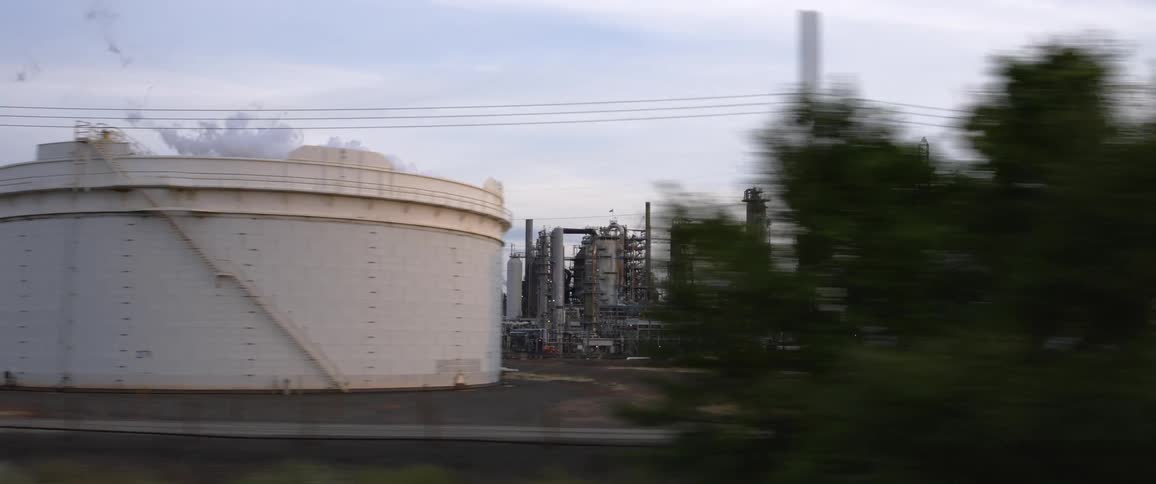 Smoke billowing out of a large factory
