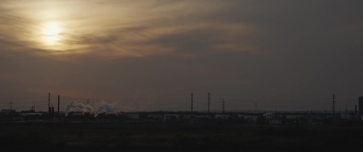 Smoke billowing out of a factory