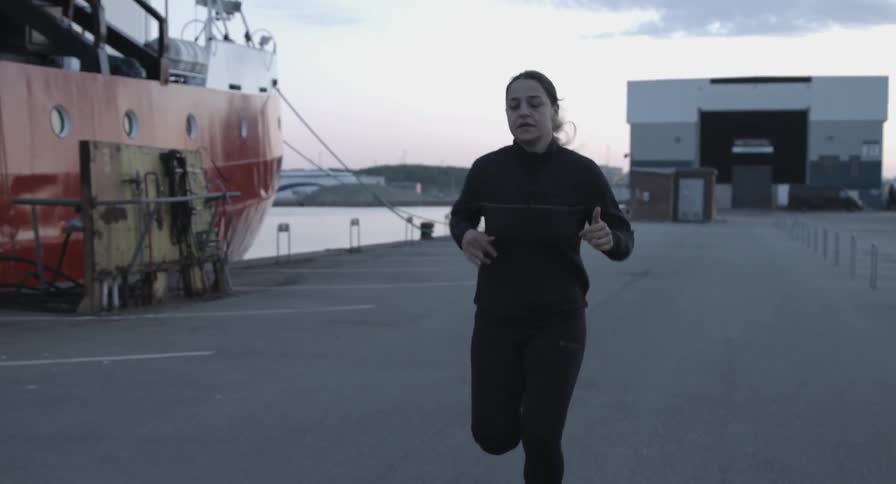 A woman running in a parking lot
