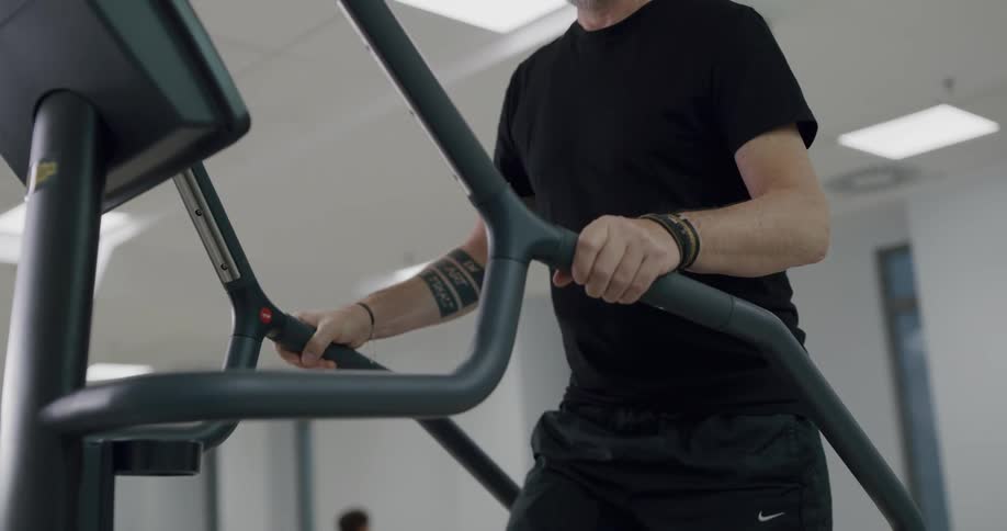 A man walking on an elliptical
