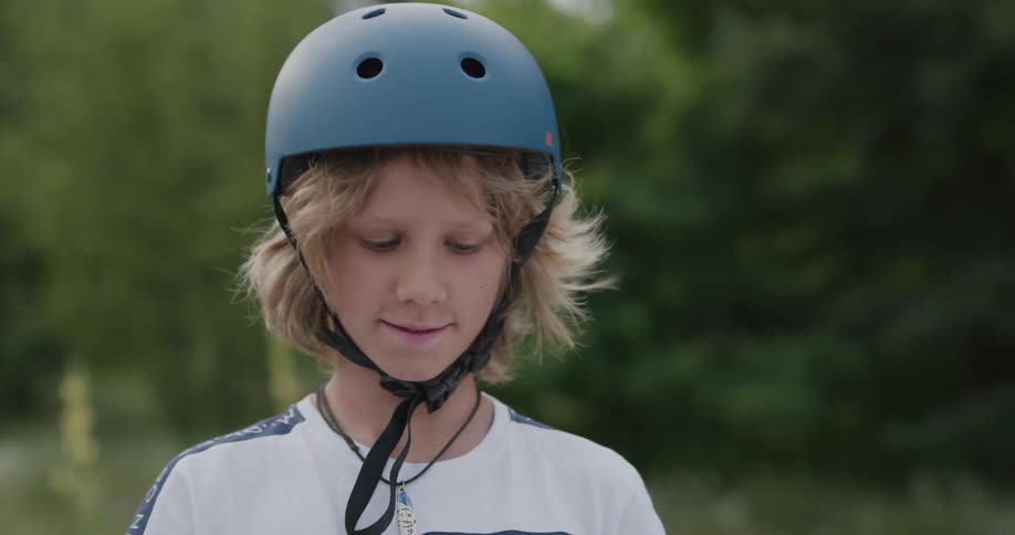 Two boys high five after fixing the chain on a bicycle