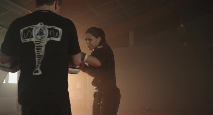 A woman spars with a partner