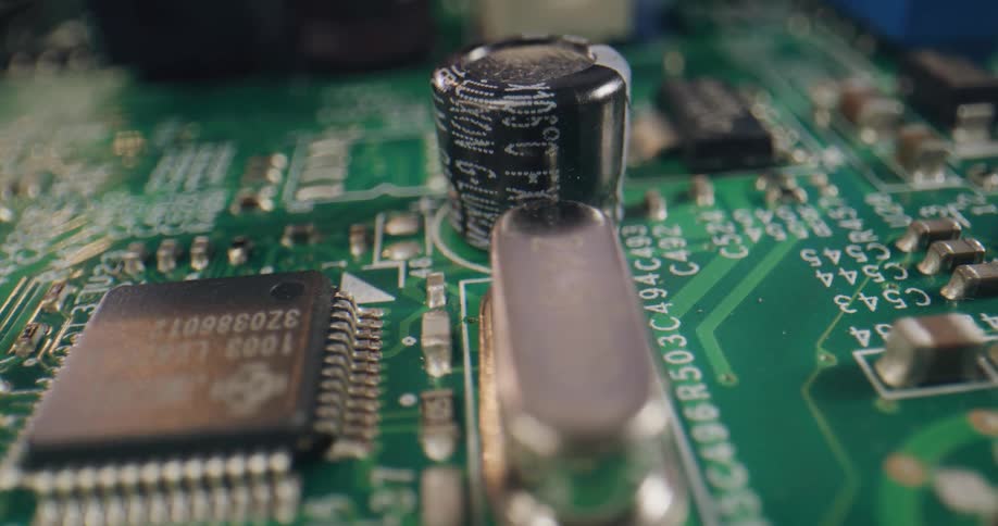 Extreme close up of the electronic circuits and components on a computer board hardware
