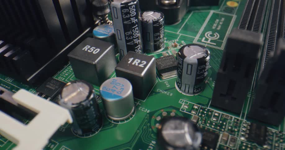 A computer motherboard with capacitors and microchips
