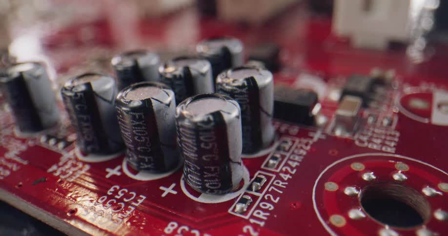 Wrapped bolts sit in bunches on top of a circuit board