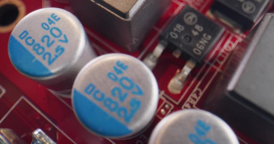 Close up of the electronic components on a red circuit board