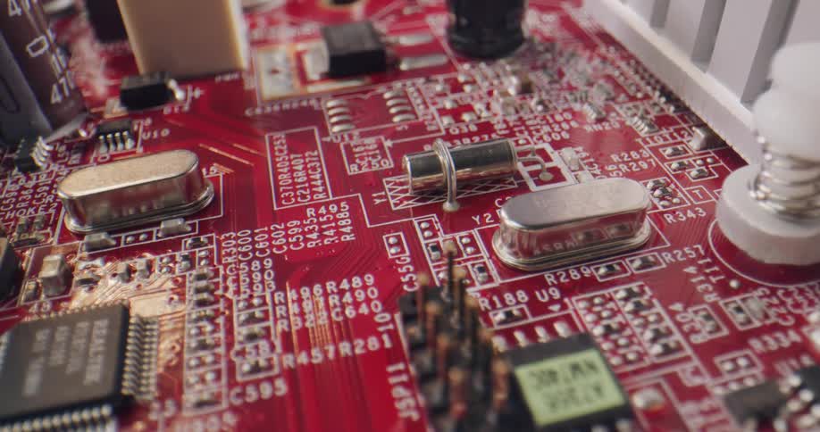 Springs encased in white plastic sit on a circuit board