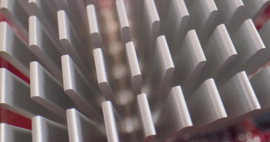 A close up of long white plastic pieces on a red base