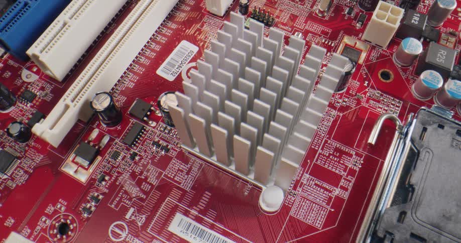 A computer motherboard with capacitors and microchips