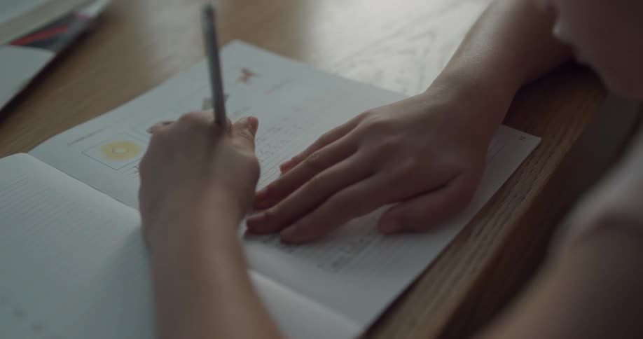 A child writing in a notebook