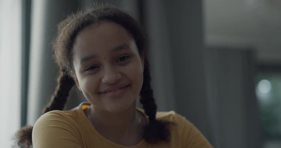 A girl looks up and smiles
