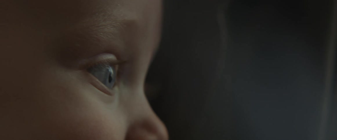 Close up of a babys face smiling