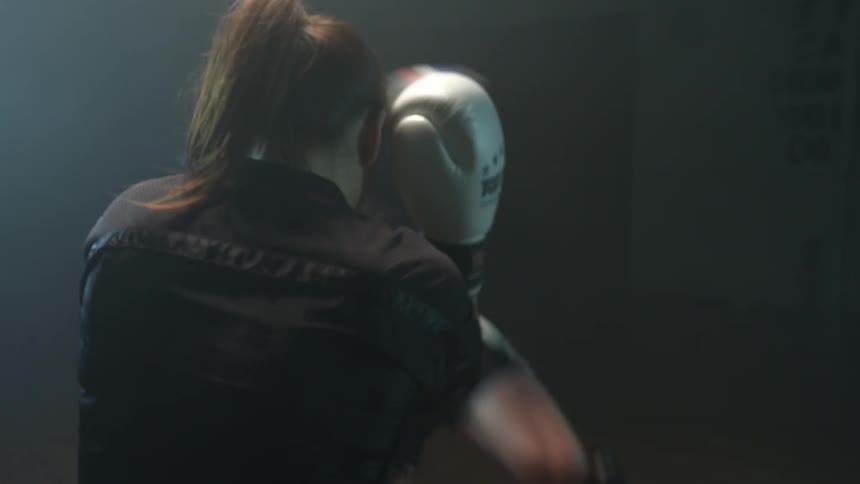 A man and woman are boxing