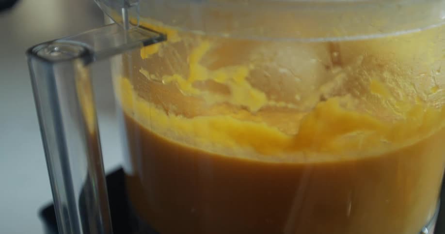 A food processor mixing puree