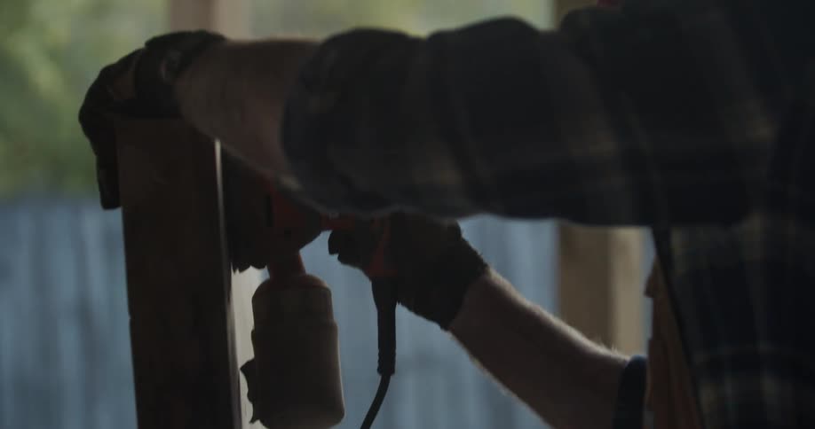 A man working on a piece of wood