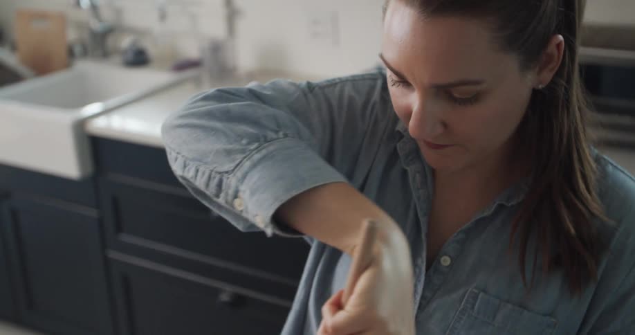 A woman mixes up ingredients for pie filling