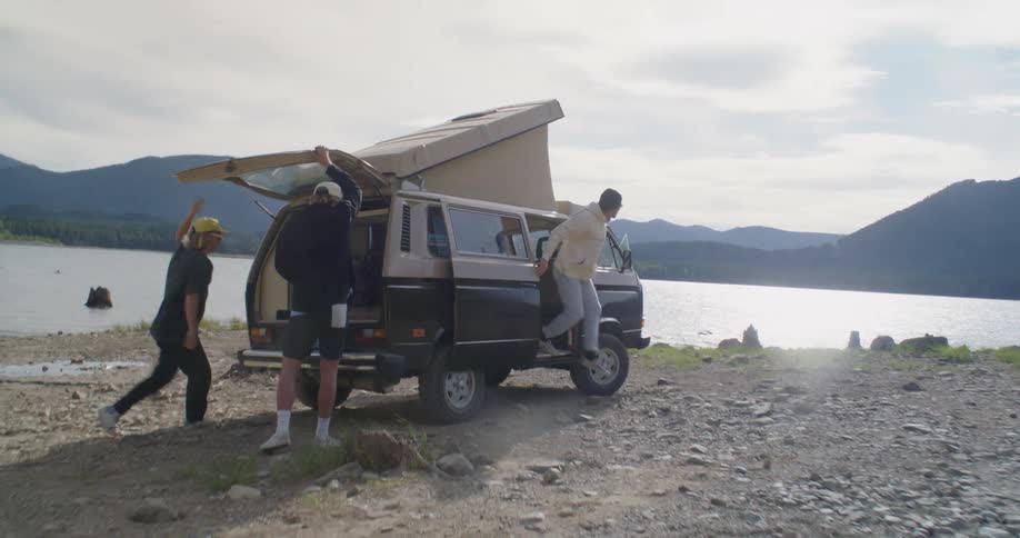 A group of people getting out of a van
