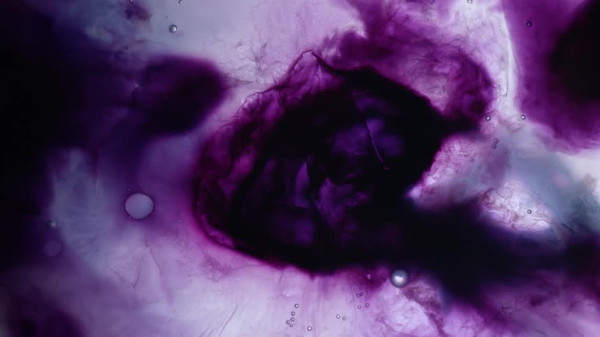Liquids in shades of purple flow into each other