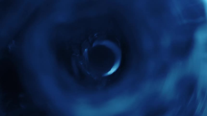 A shot inside of a tube with rushing water