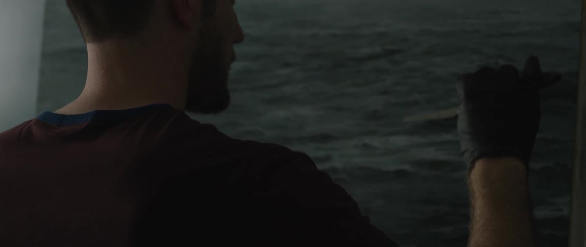 A man is painting an ocean
