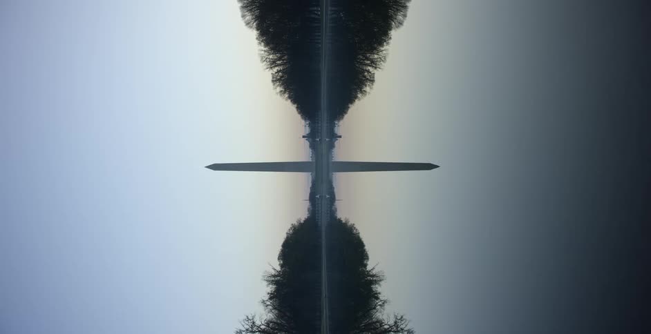 Sideways shot of the washington monument reflection on the pool at sunset