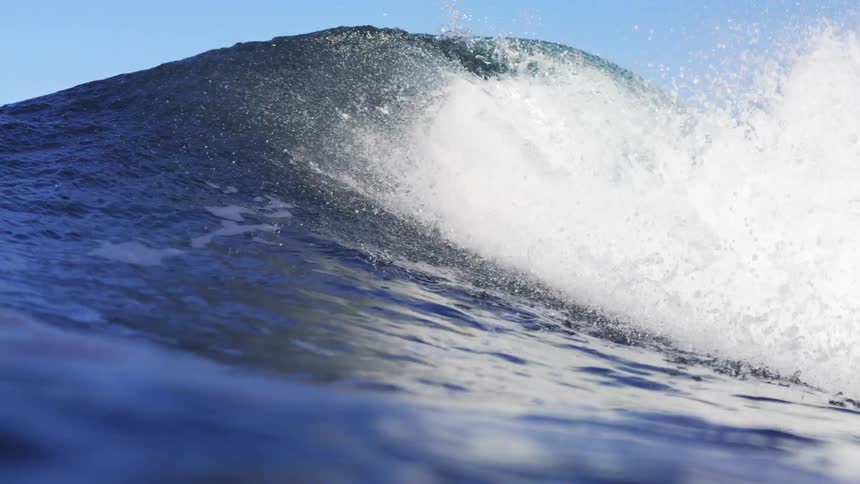 Huge wave splashing as it rolls in