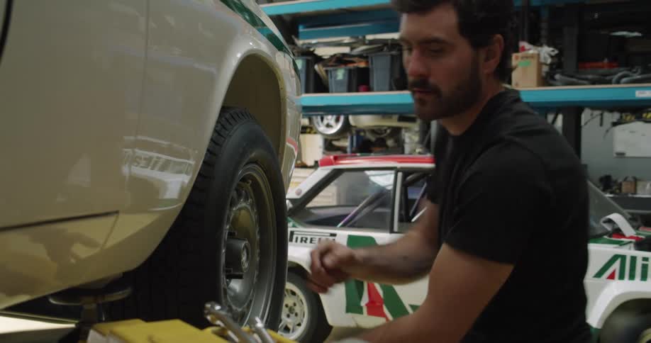 A man working on a car in an auto shop