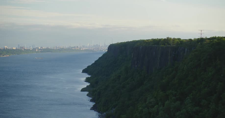 Aerial view of new york city skyline on the horizon at evening