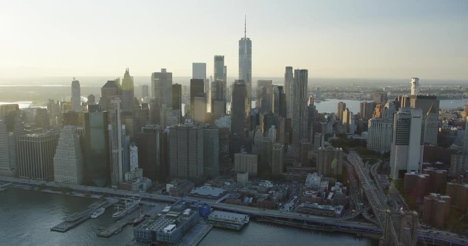 The sun is rising on the large city