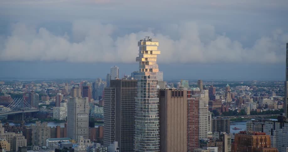 The tall buildings reach into the clouds