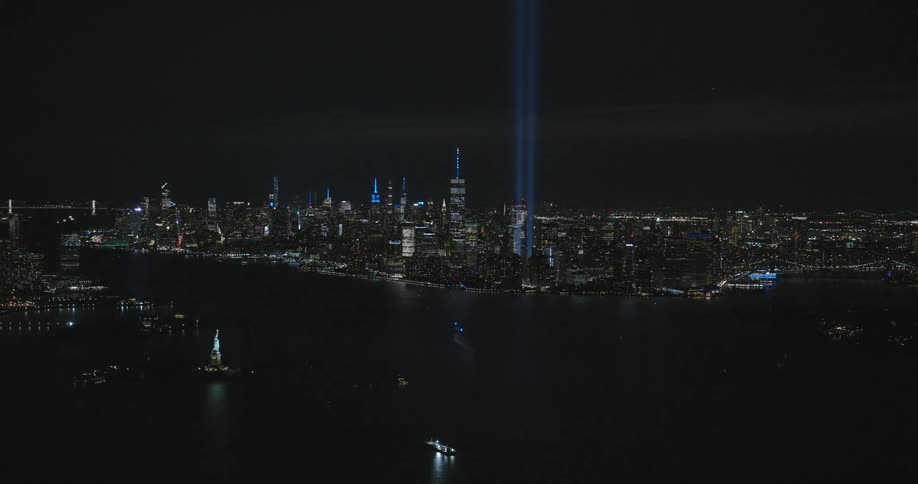 The tribute in light art installation next to the one world trade center in manhattan at night