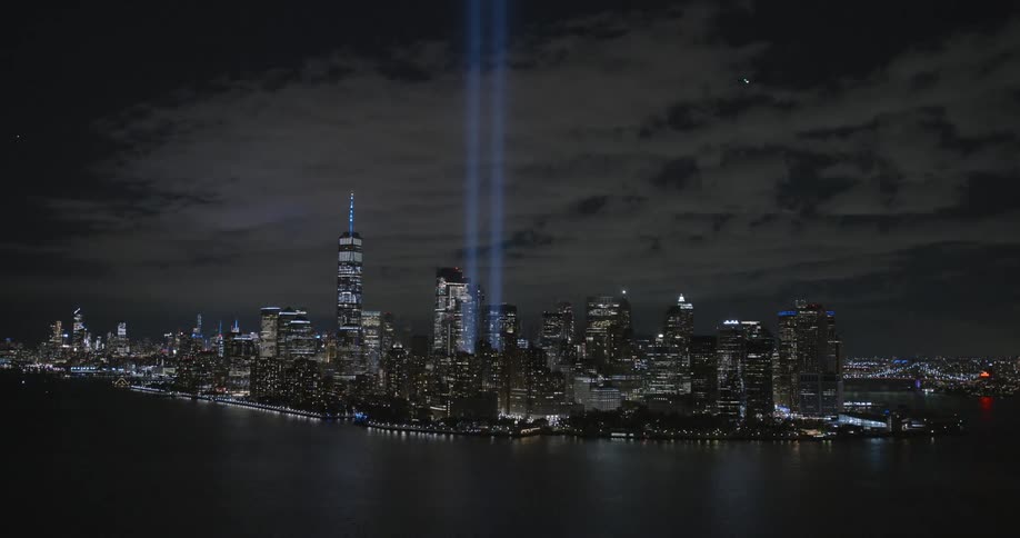 A plane flies high over the large city