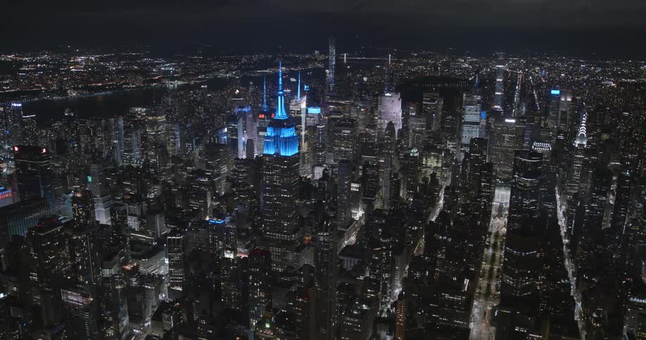 Nighttime view of a city with buildings and streets