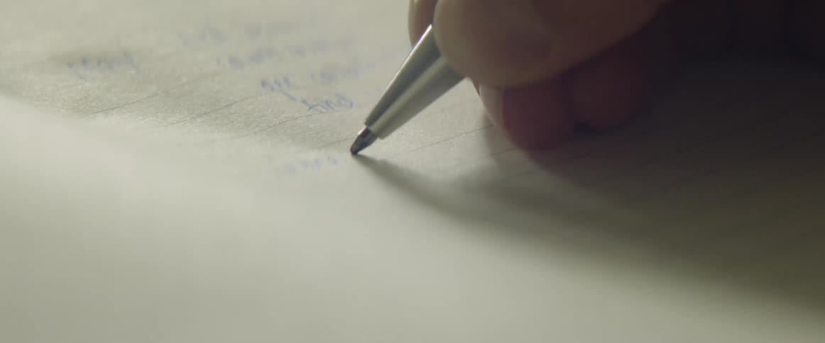 A woman writing on paper