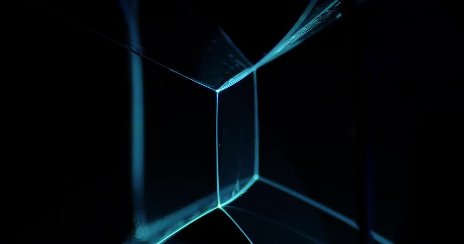 Abstract footage of blue neon lights joining together
