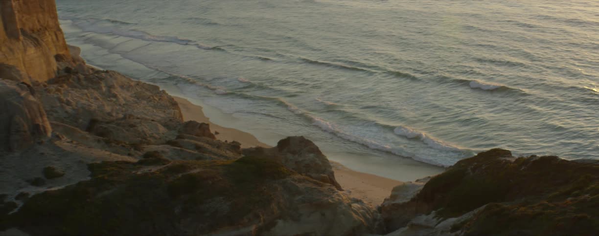 Waves rolling in to the sandy shore