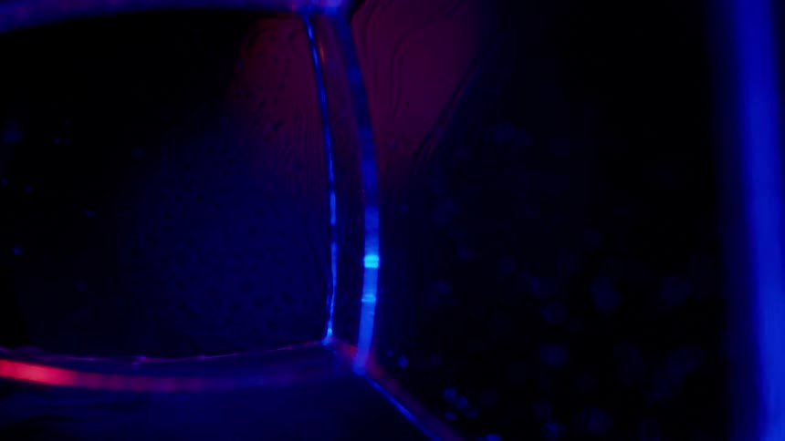 Blue black and red colors that look like water and bubbles