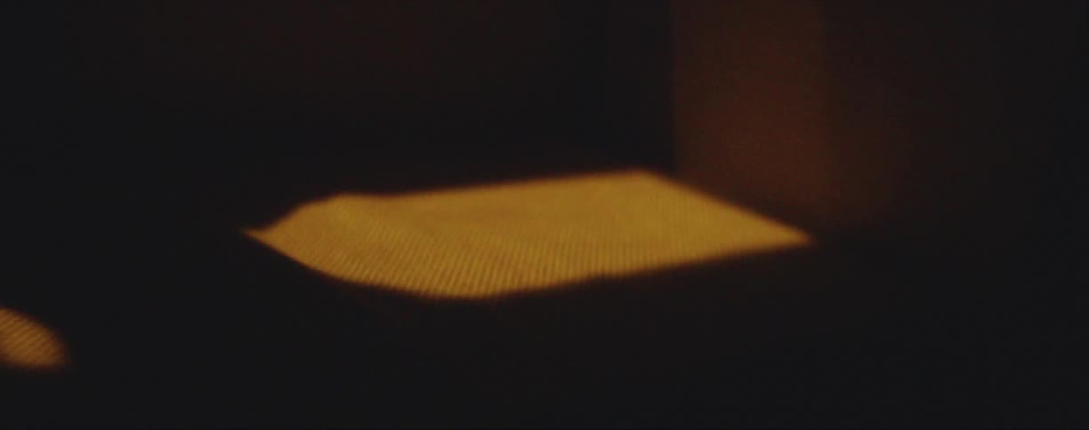 The sun shining in a room and causing shadows