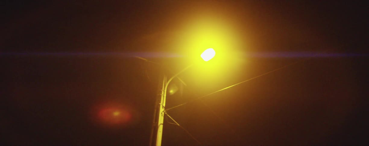 The flare coming off a street light at night