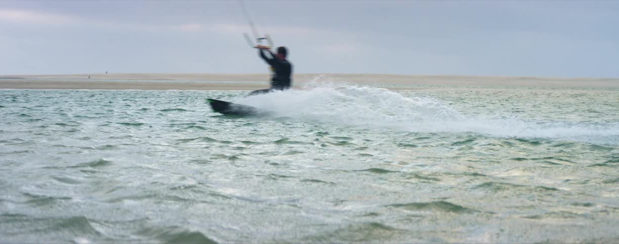 A person wake boarding in the water
