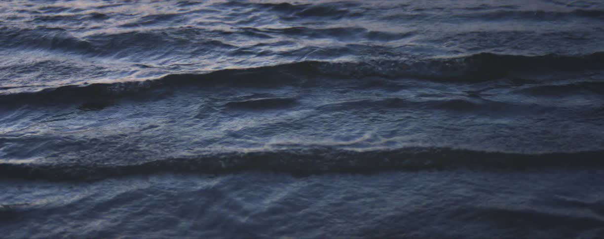 Water waves rippling as they roll in