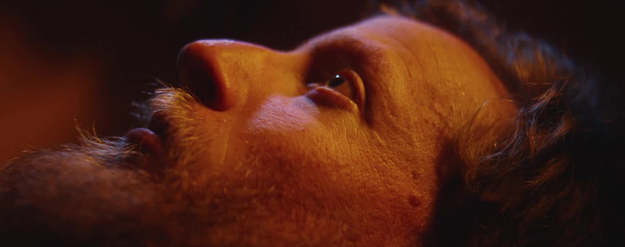 A person is laying lifeless facing up