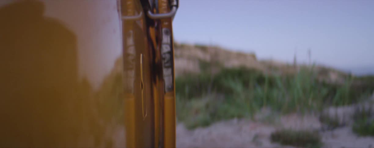 An orange van door slides open