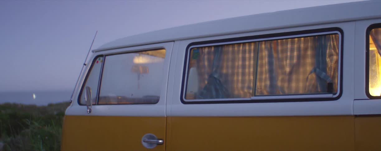 A light turning on inside a parked vw bug van