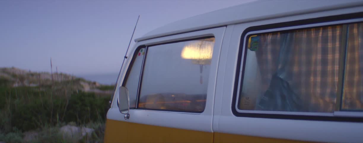 A light turns on in a van parked outside