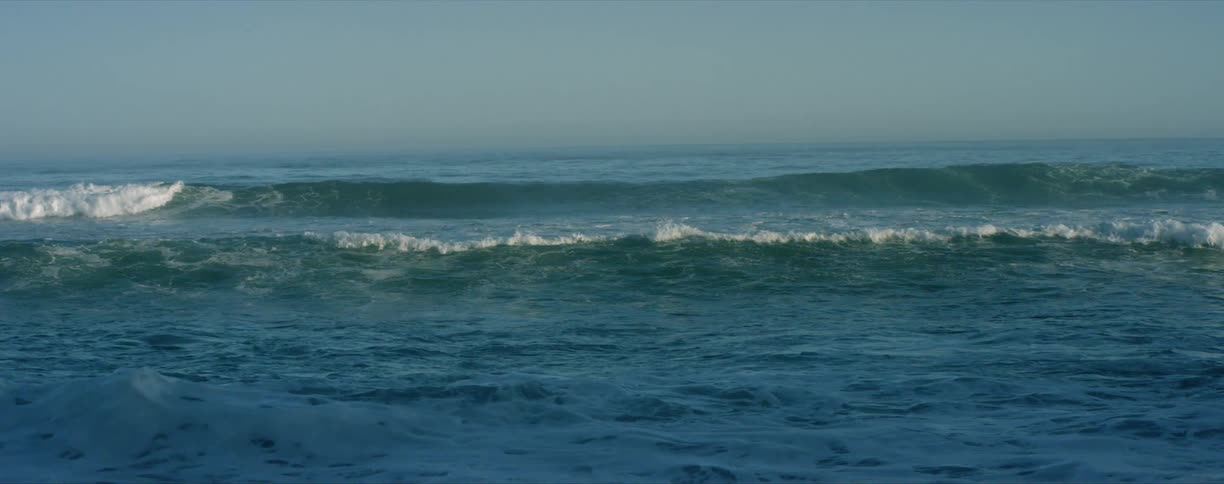 Rolling waves on the ocean on a misty day