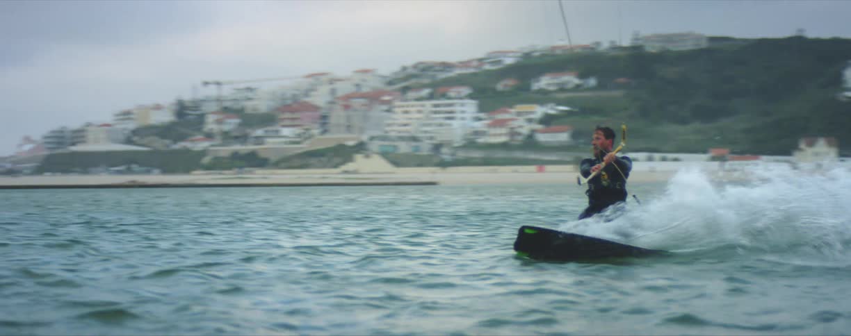 A man wake boarding on the water