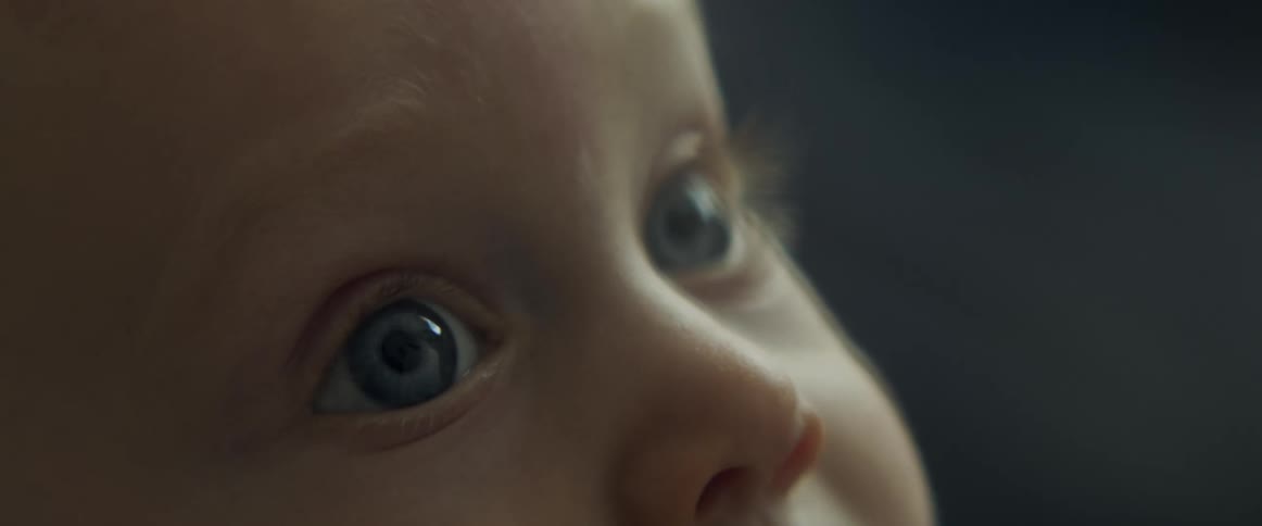 Close up of a babys face looking up