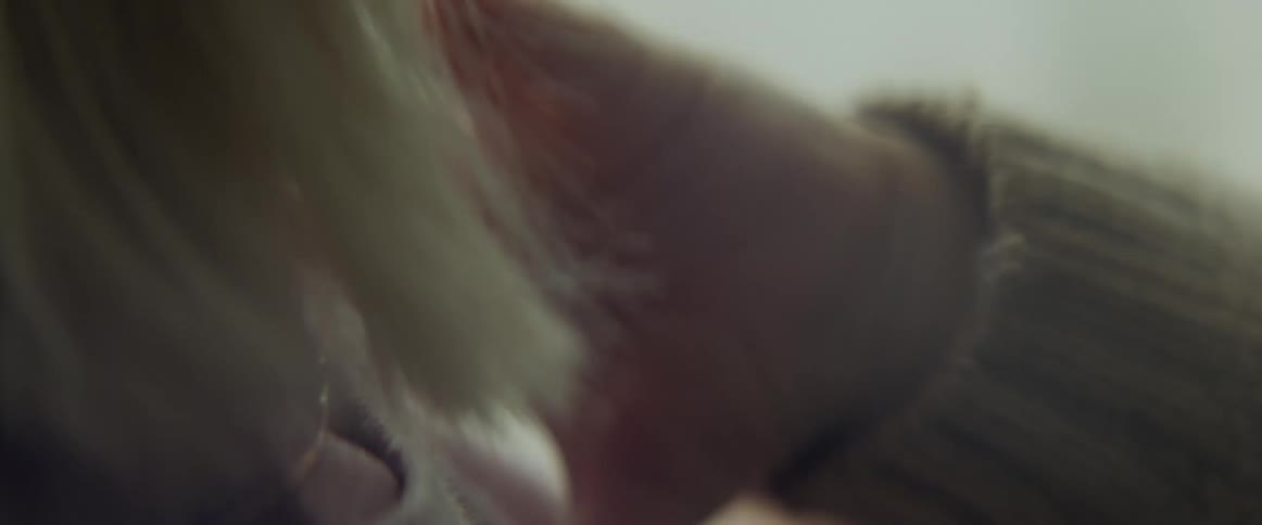 Close up of a babys hand touching mothers cheek
